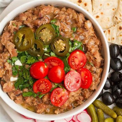  Ful Medames: Een romige bonenschotel met een pikante twist van citroen en knoflook!